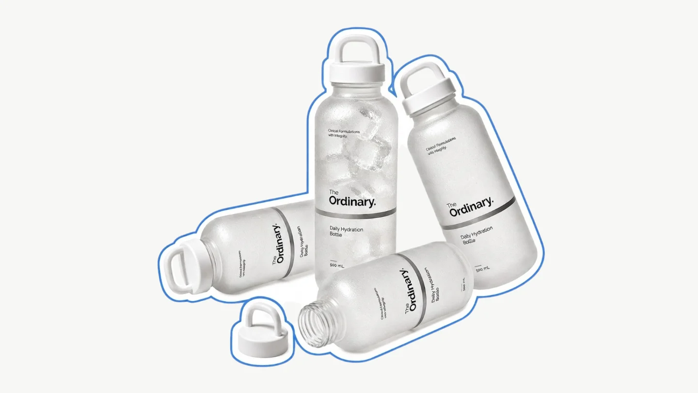 Four of The Ordinary's Daily Hydration Bottles, in translucent frosted glass with a white cap.